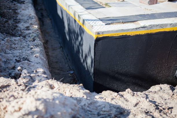 Professional Basement Waterproofing technician working in Audubon, PA